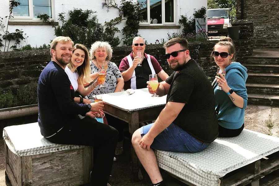 People drinking cider at the Ty Gwyn Cider shop and bar